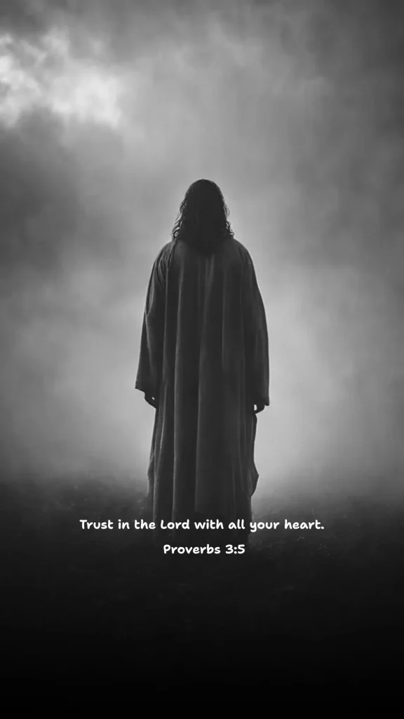 Back view of Jesus standing in mist under cloudy skies, wearing a long robe, with Proverbs 3:5 — “Trust in the Lord with all your heart.” Black and white inspirational Bible verse wallpaper for faith and reflection.